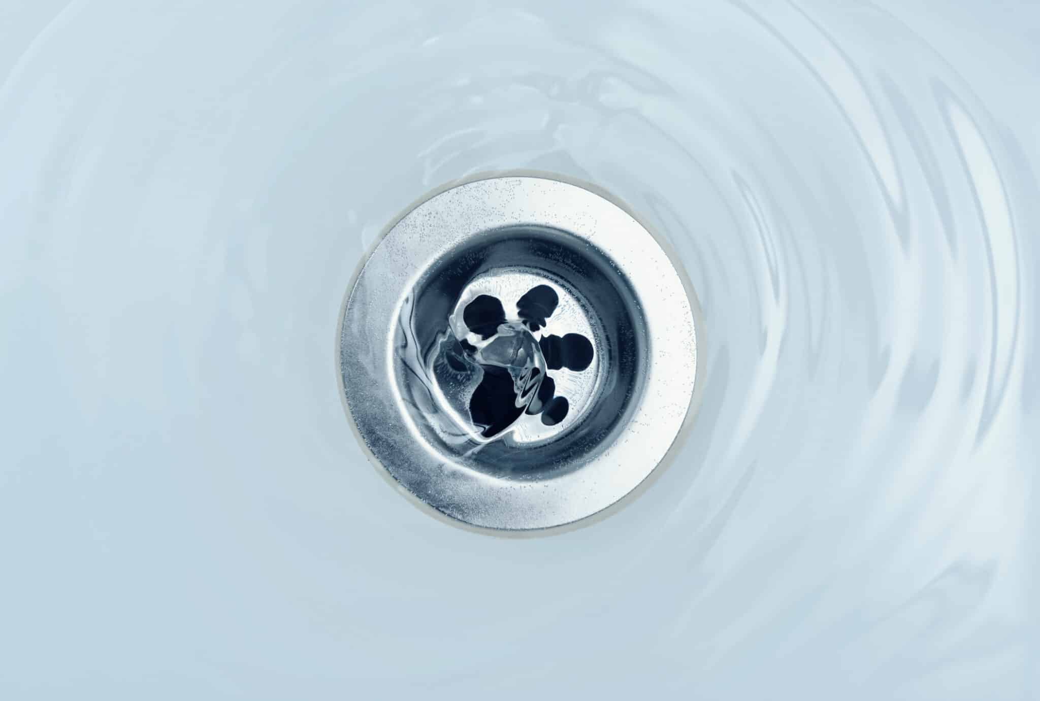 Water flow into drain in bath, Regular Drain Cleaning.