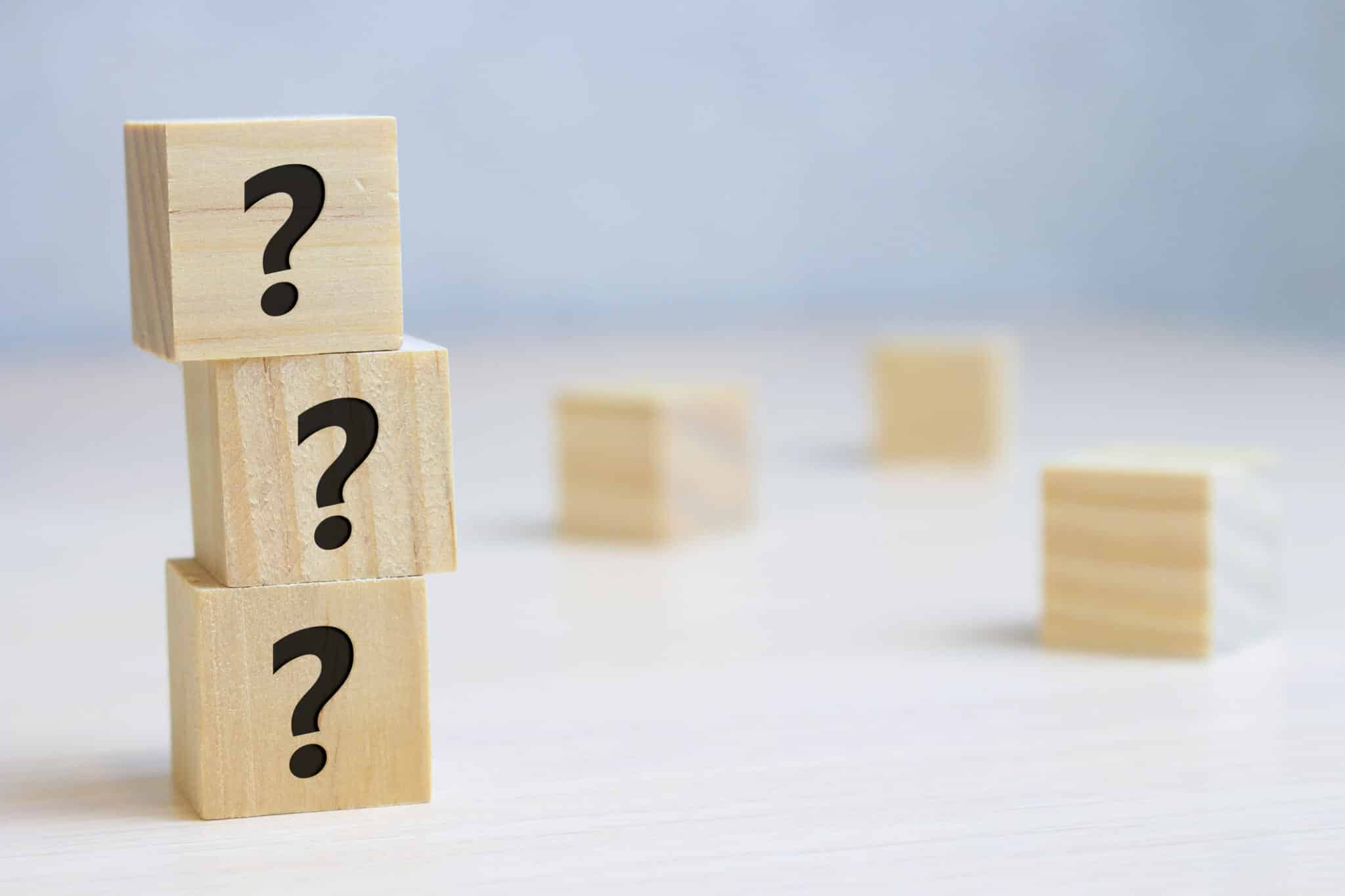 Wooden cube block shape with sign question mark symbol on wood table, Boiler Maintenance.