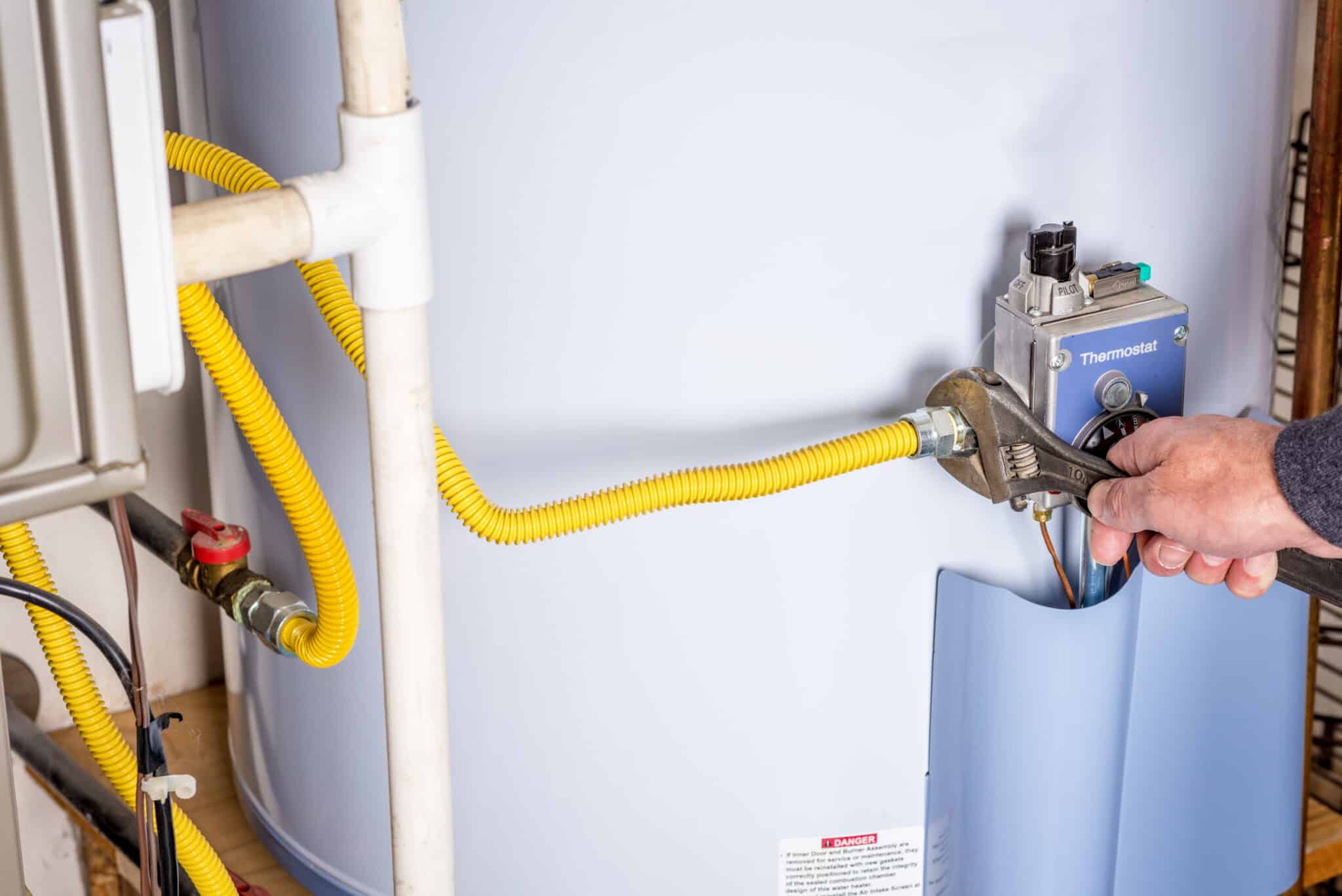 Wrench on a gas line for a hot water heater, Gas Line Safety.