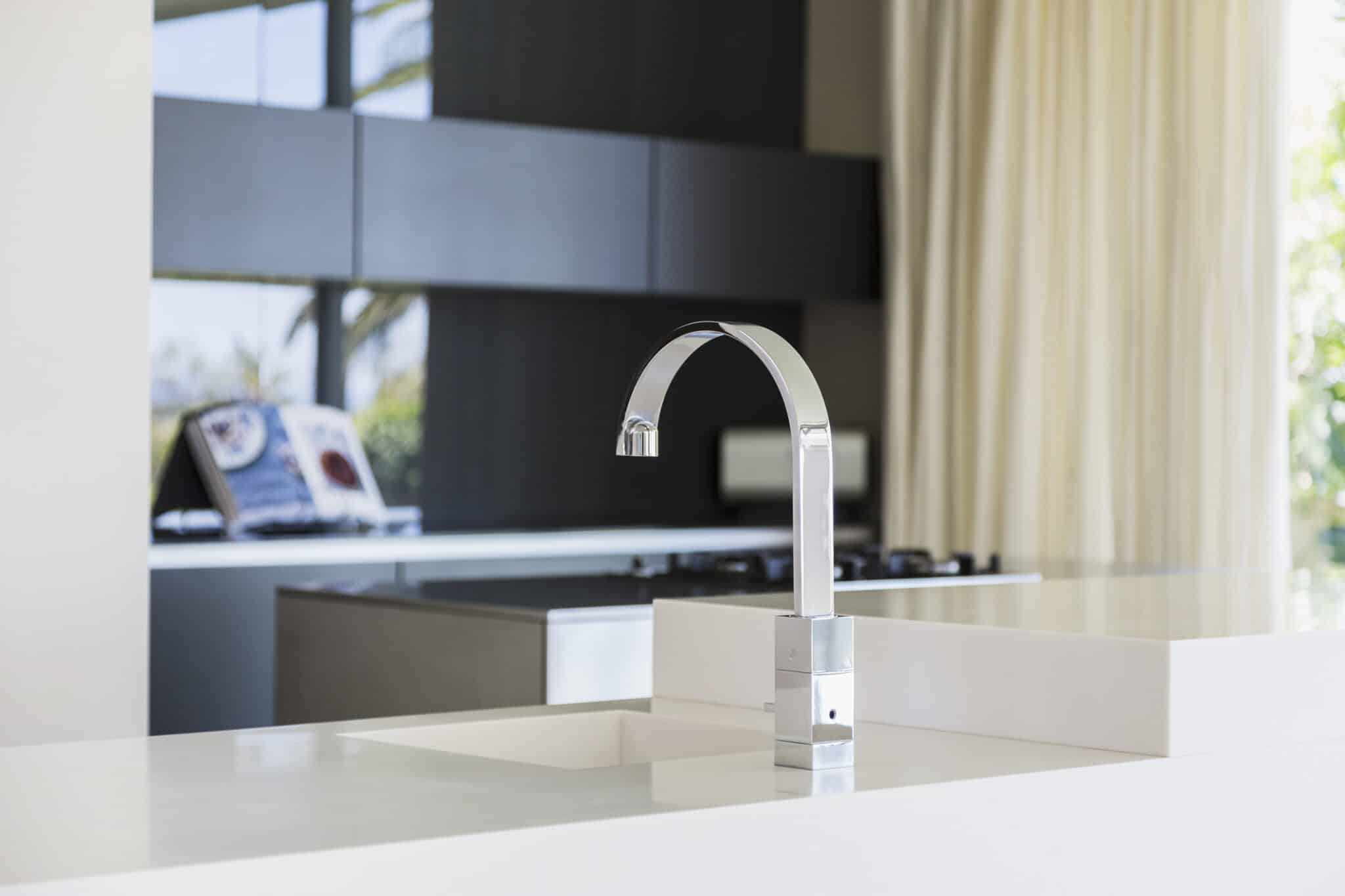 Faucet and sink in modern kitchen, Kitchen Plumbing Fixtures.