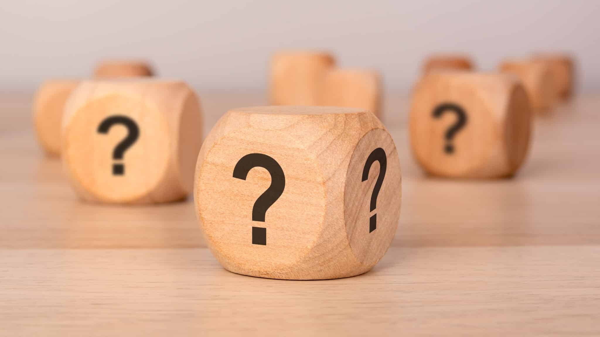 Wooden cubes with question marks, Water hammer solutions.