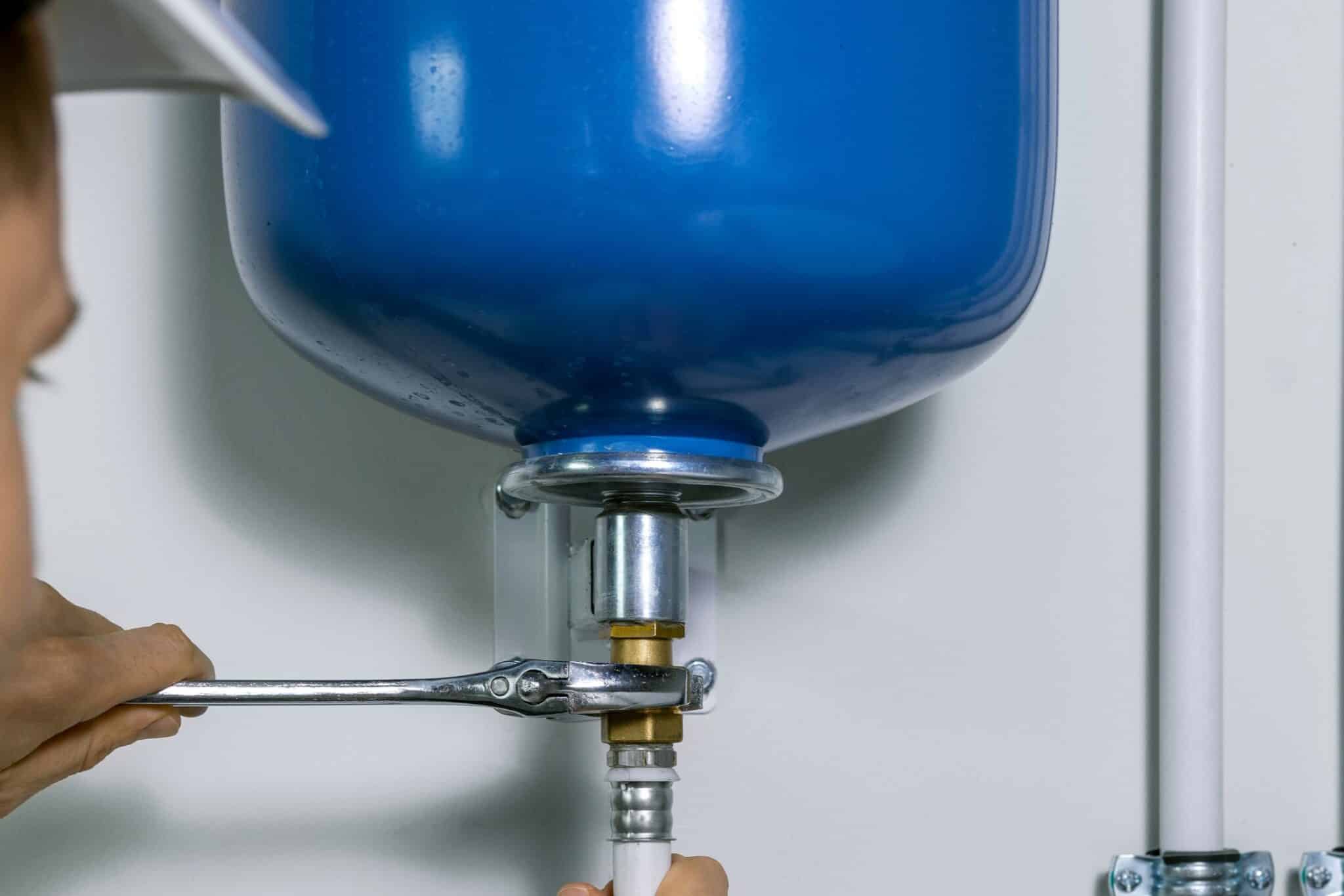 Expansion Tank Install for Stable Home Water Pressure 1 Plumber installing expansion tank for house heating system, Expansion tank install.