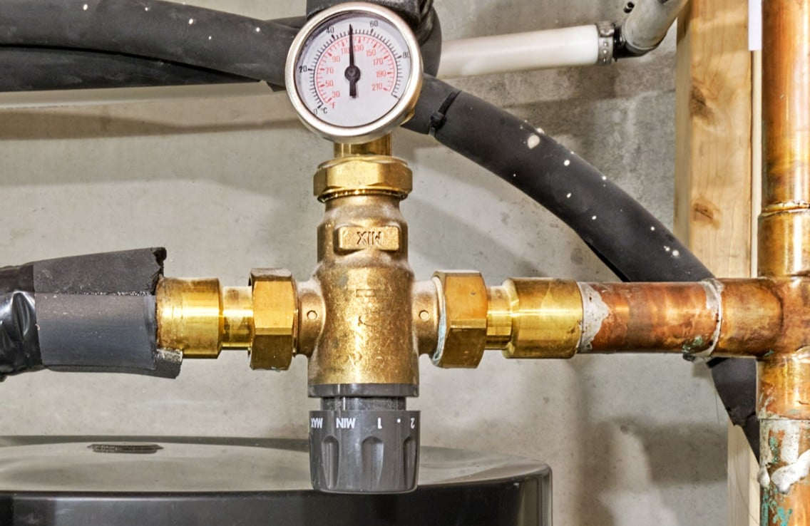 Thermostatic mixing valve benefits for safer home hot water.