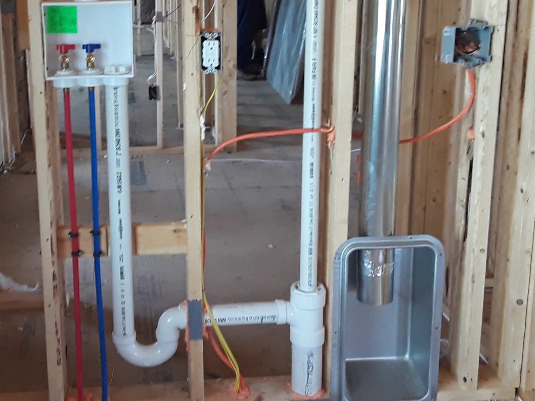 Basement drain install planning for laundry and utility rooms.